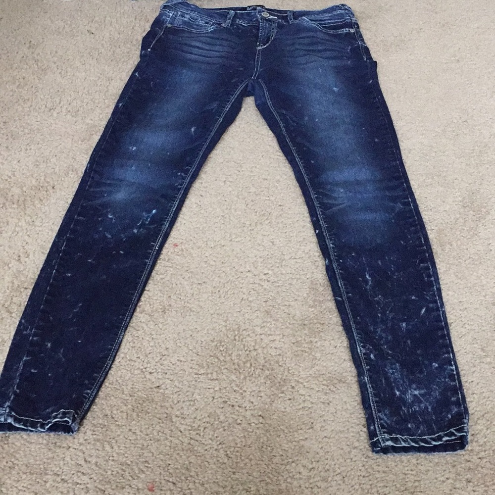 Dark blue jeans with white splattered details